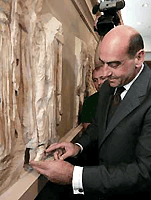 Greek Culture Minister George Voulgarakis places a fragment of the Parthenon north frieze in its original place inside the Acropolis Museum on 5 September 2006. The marble piece was handed back to Greece from Germany's University of Heidelberg