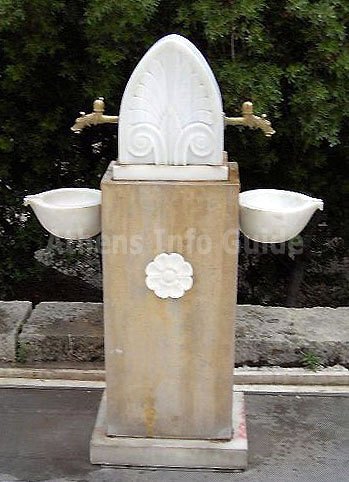 Water fountain at the square in front of the Odeion of Herodes Atticus  