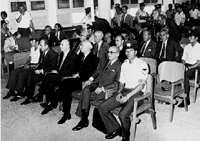Junta members on trial. Front row (left to right not including the police man): Papadopoulos, Makarezos, Pattakos. Ioannides is on the second row behind Pattakos