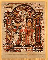 Linen and woolen screen curtain (velum) with a representation of a couple praying beneath an apse and a Coptic inscription written in Greek script. It comes from a monastery at Antinoe in Egypt and dates to the 5th-6th century BC - Benaki Museum (photo: Makis Skiadaressis)