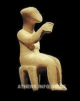 The cup-bearer, seated figurine in once marble piece (2.800-2.300 BC) – Museum of Cycladic Art